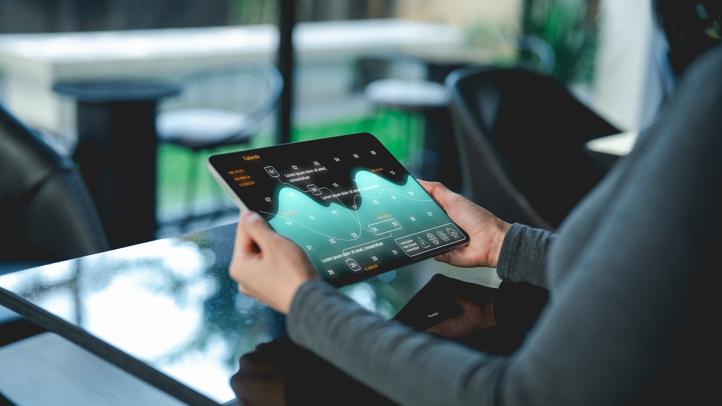 Businesswoman viewing statistics on tablet screen