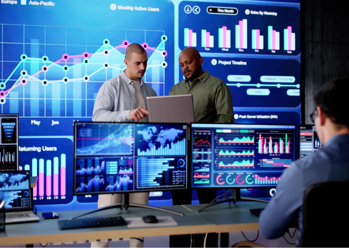 Professionals reviewing digital charts and graphs