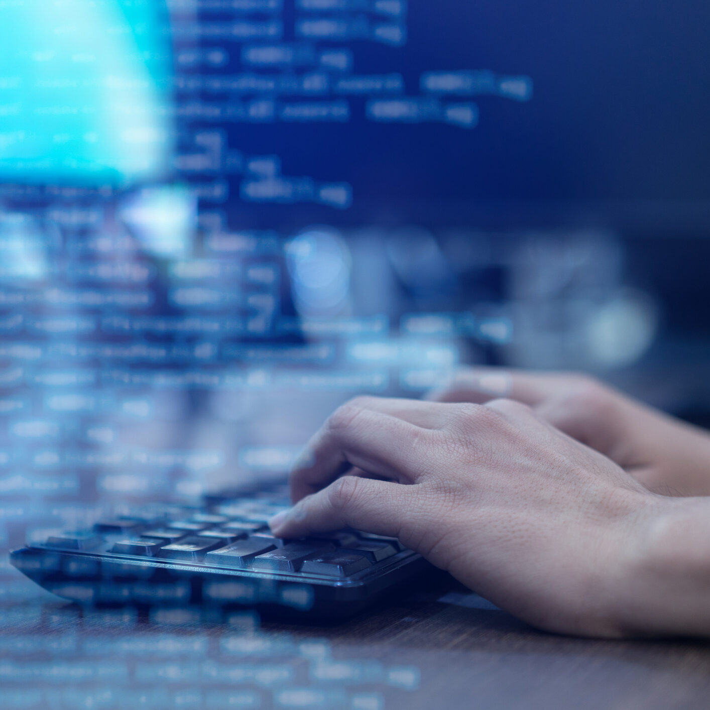 close up programmer man hand typing on keyboard at computer desktop for input coding language to software for fix bug and defect of system in operation room , technology concept