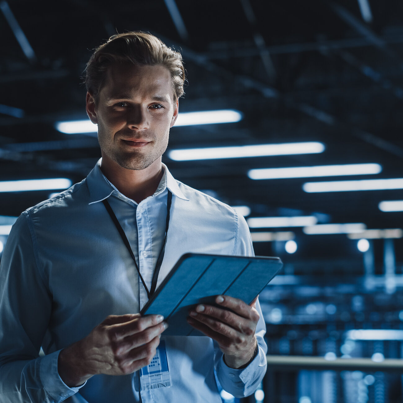 Man using tablet in modern data center