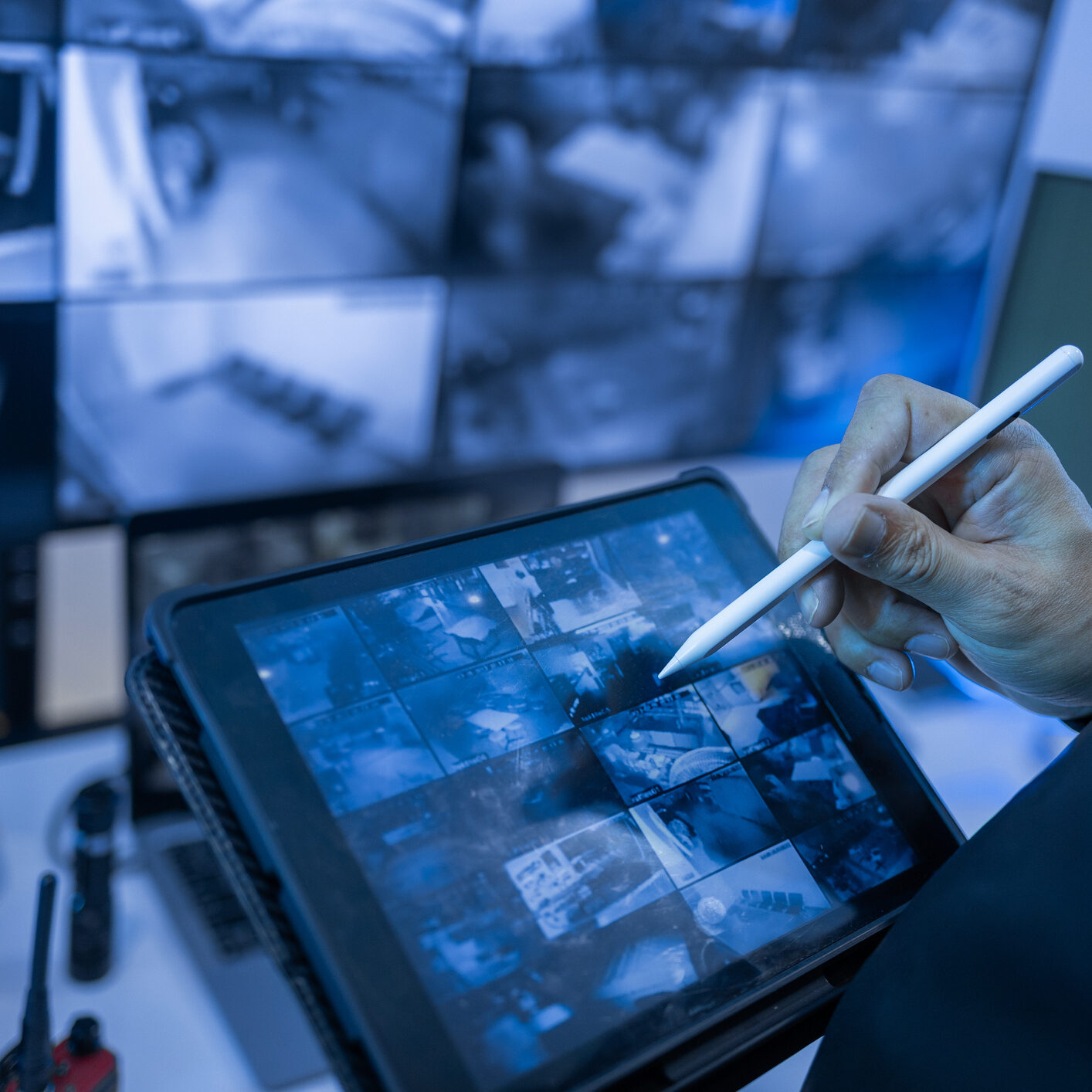 Tablet displaying security camera feeds